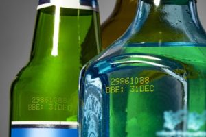 Glass bottles with yellow ink numbers