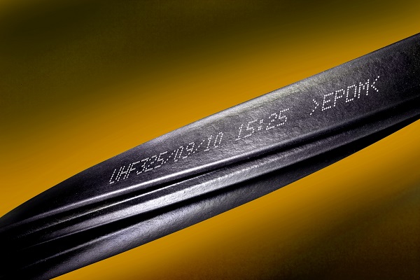 Black metal cable with date and "X-FORM"