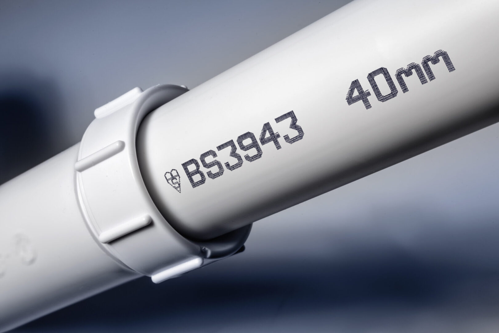 White PVC pipe with BS3943 and 40mm markings.