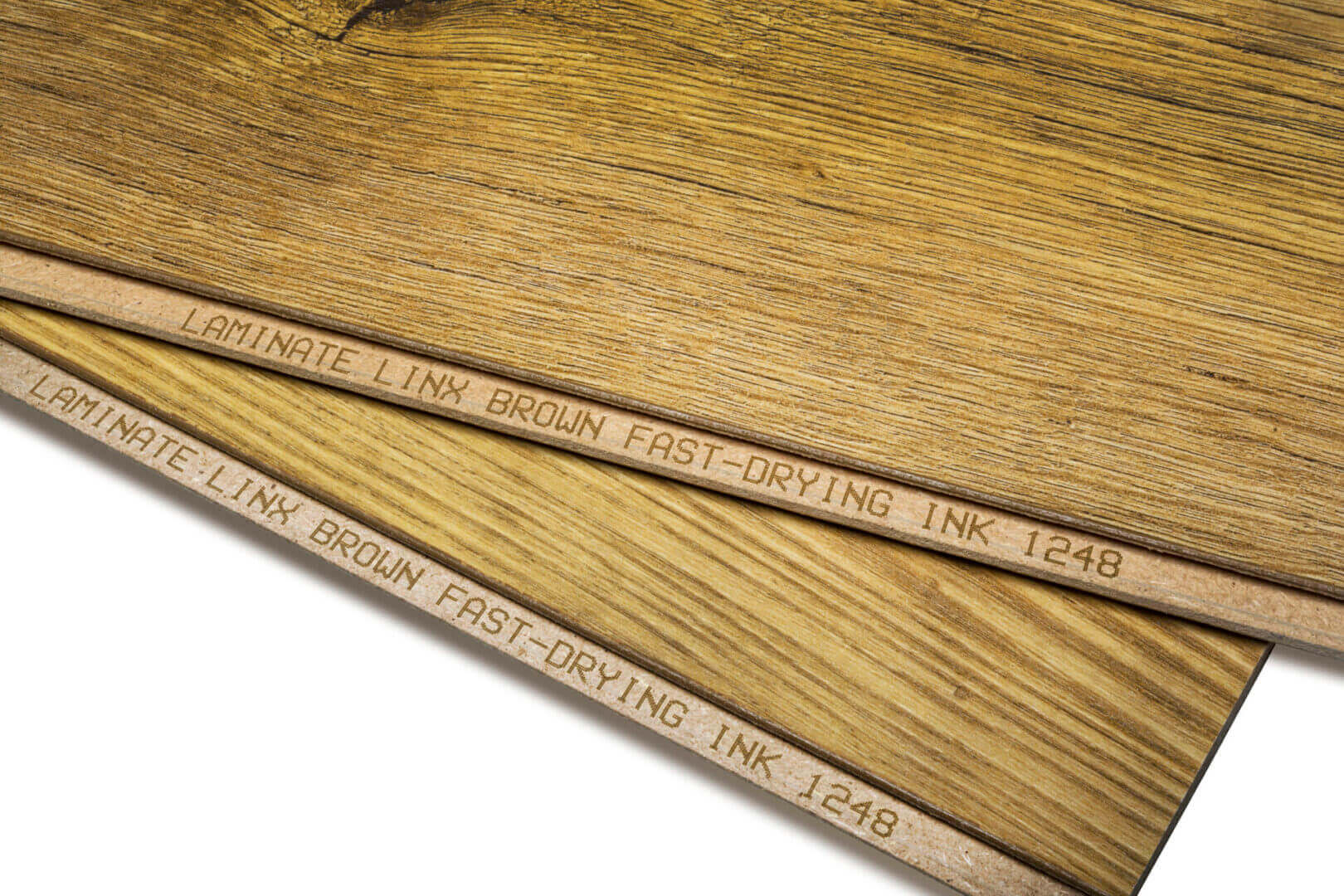 Laminate flooring samples, brown wood grain.