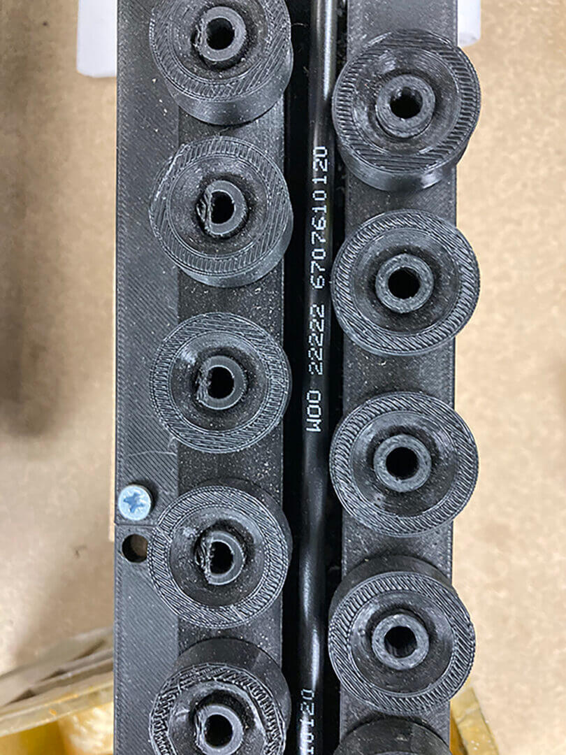Black circular objects in a row.
